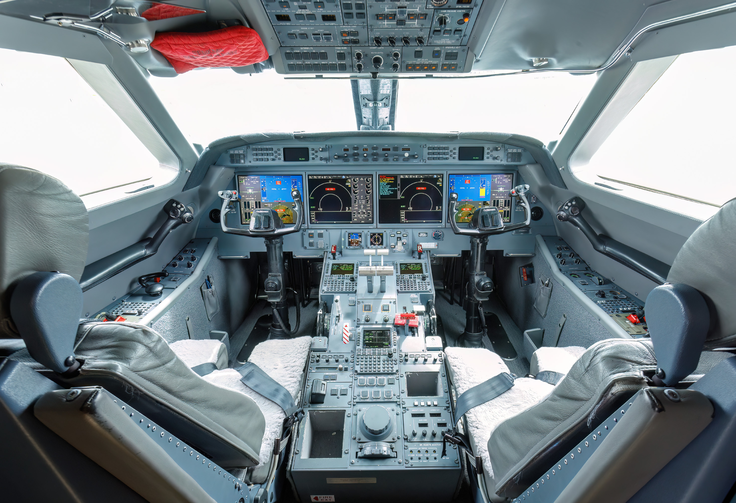 Private aviation aircraft in flight above a destination